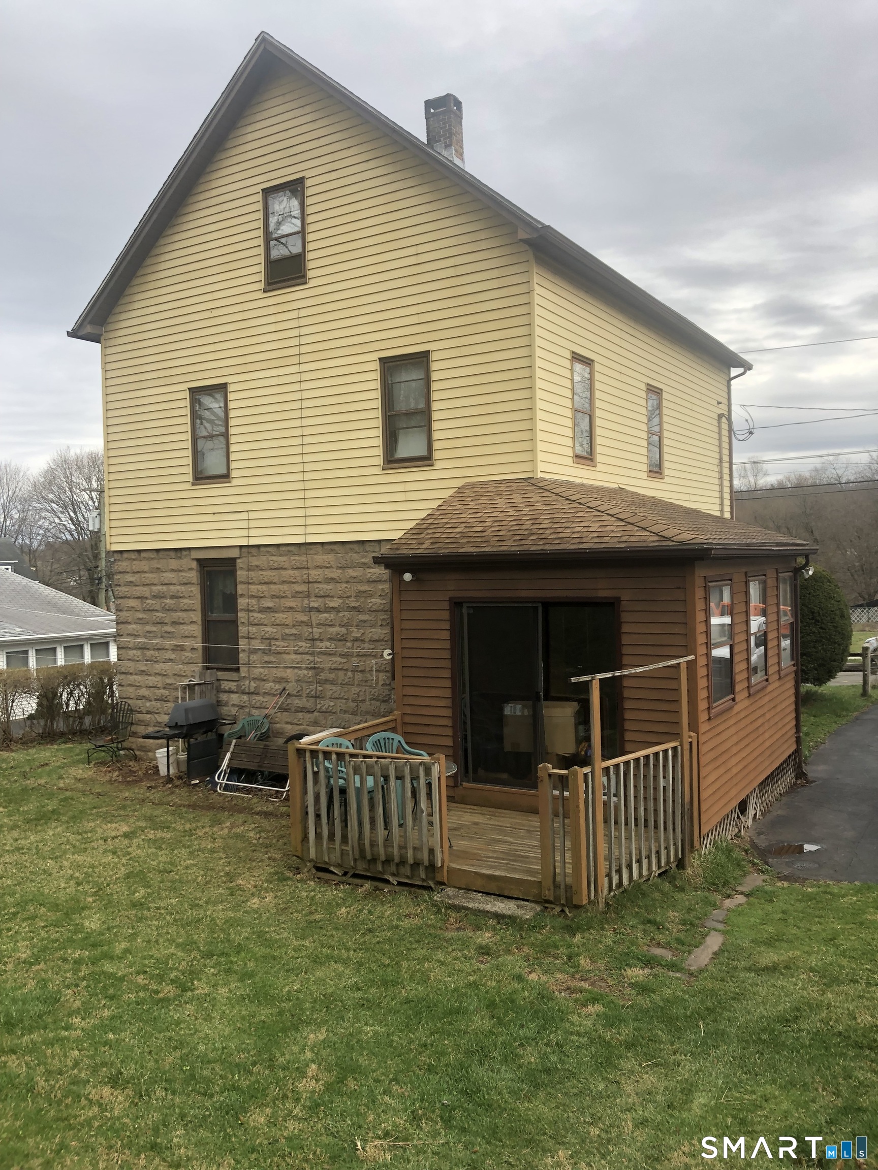161 Spring Street Meriden, CT 06451 - Photo 5 of 22 a backyard of a house with table and chairs