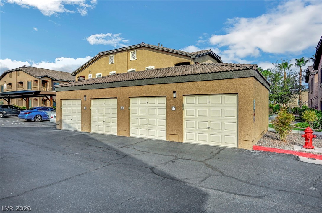 8985 South Durango Drive, Unit 2187 Las Vegas, NV 89113 - Photo 50 of 73 Attached garage with ample parking space and convenient access to the residential building.