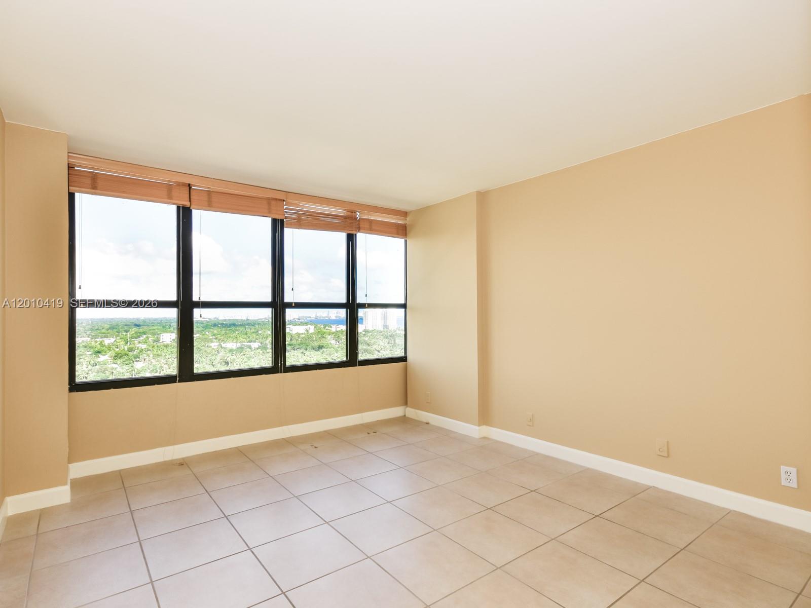 780 Northeast 69th Street, Unit 1908 Miami, FL 33138 - Photo 11 of 18 a view of an empty room with a window