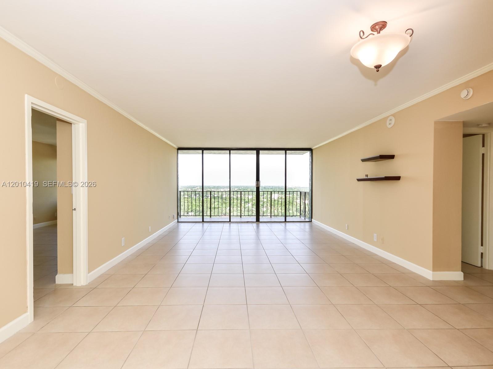 780 Northeast 69th Street, Unit 1908 Miami, FL 33138 - Photo 5 of 18 a view of an empty room with a window