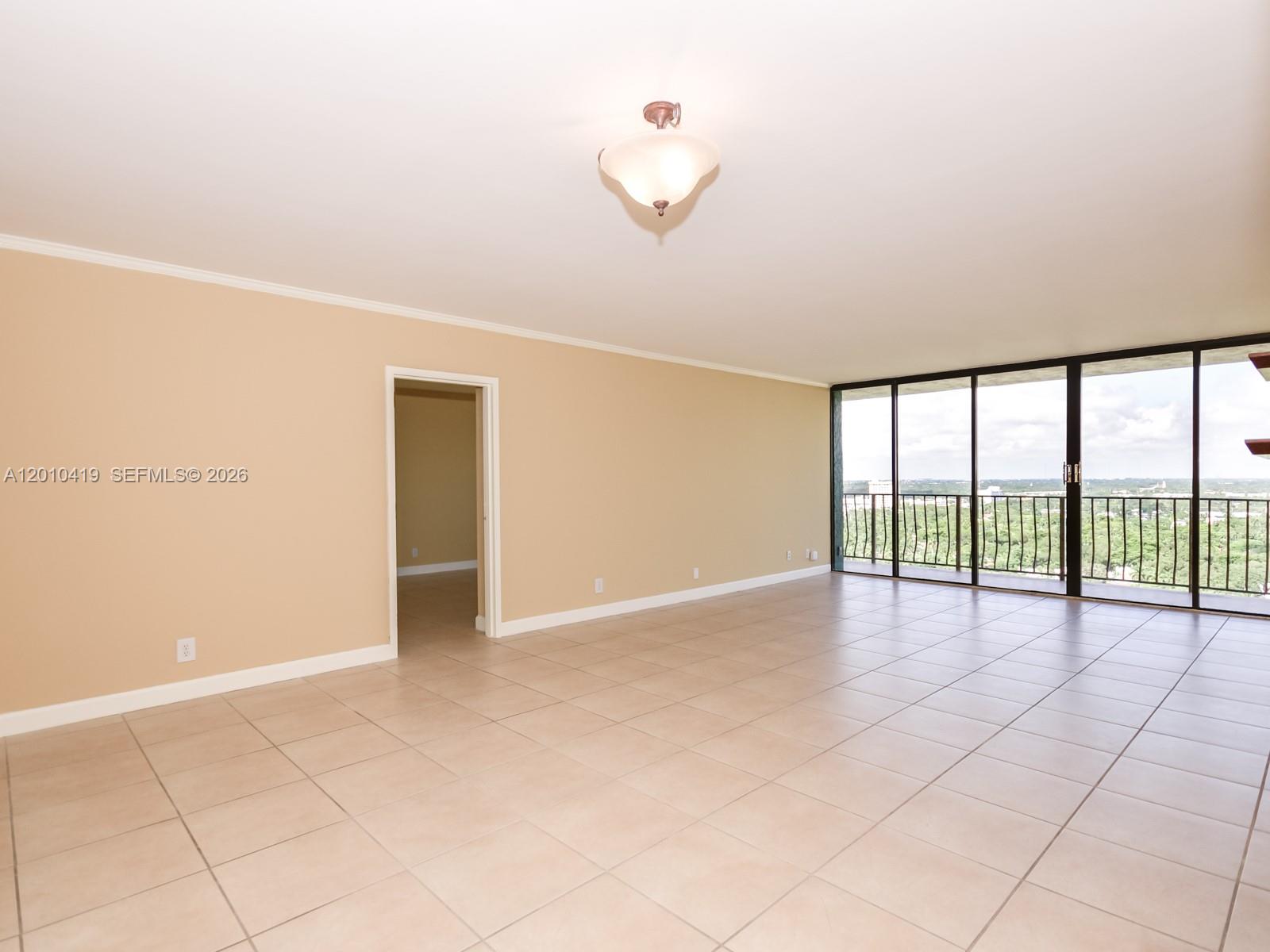 780 Northeast 69th Street, Unit 1908 Miami, FL 33138 - Photo 6 of 18 a view of an empty room with a window