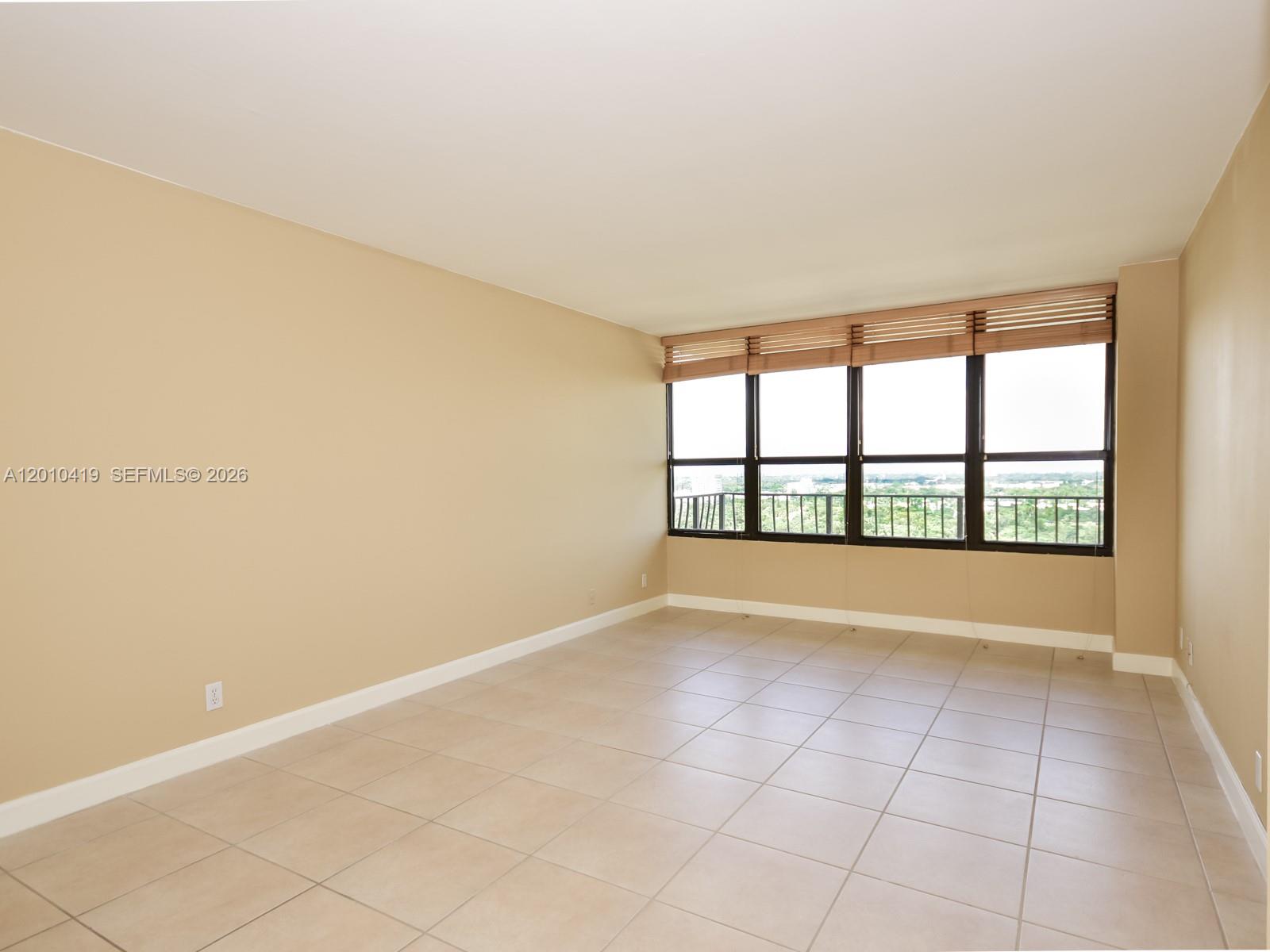 780 Northeast 69th Street, Unit 1908 Miami, FL 33138 - Photo 8 of 18 a view of an empty room with a window