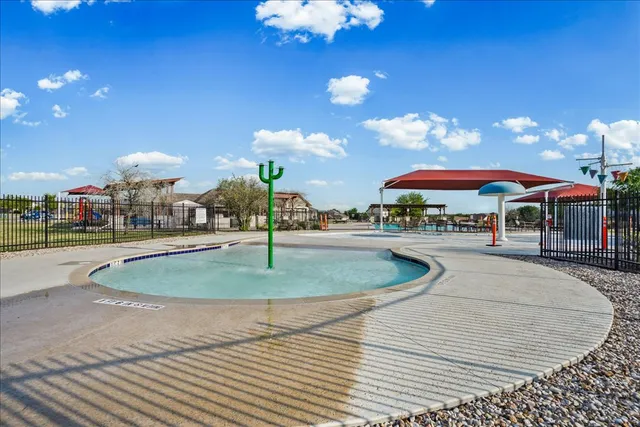a swimming pool with outdoor seating