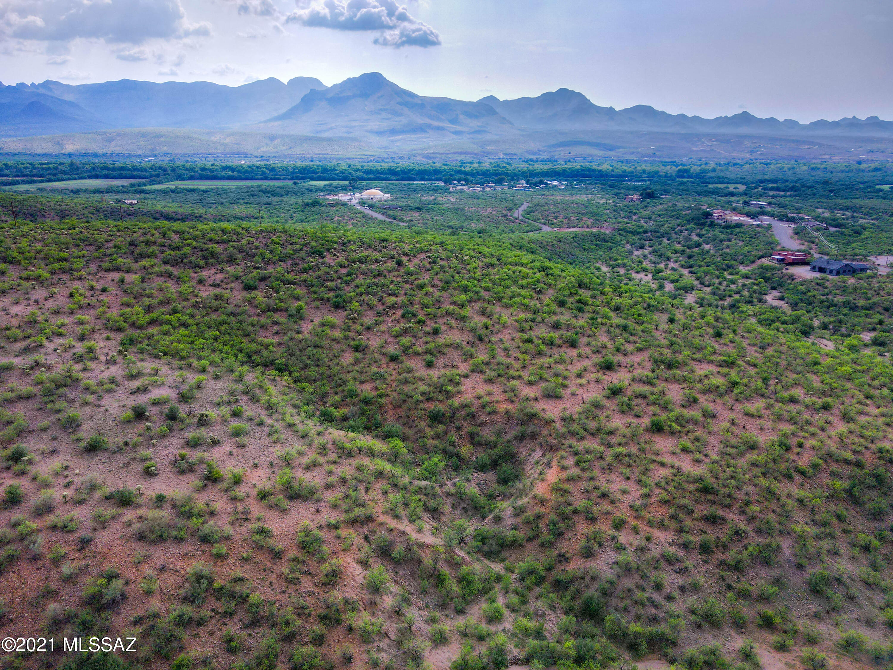 48 Calle Dinamarca, Unit 19 Rio Rico, AZ 85648 - Photo 8 of 15 a view of a lush green hillside and houses