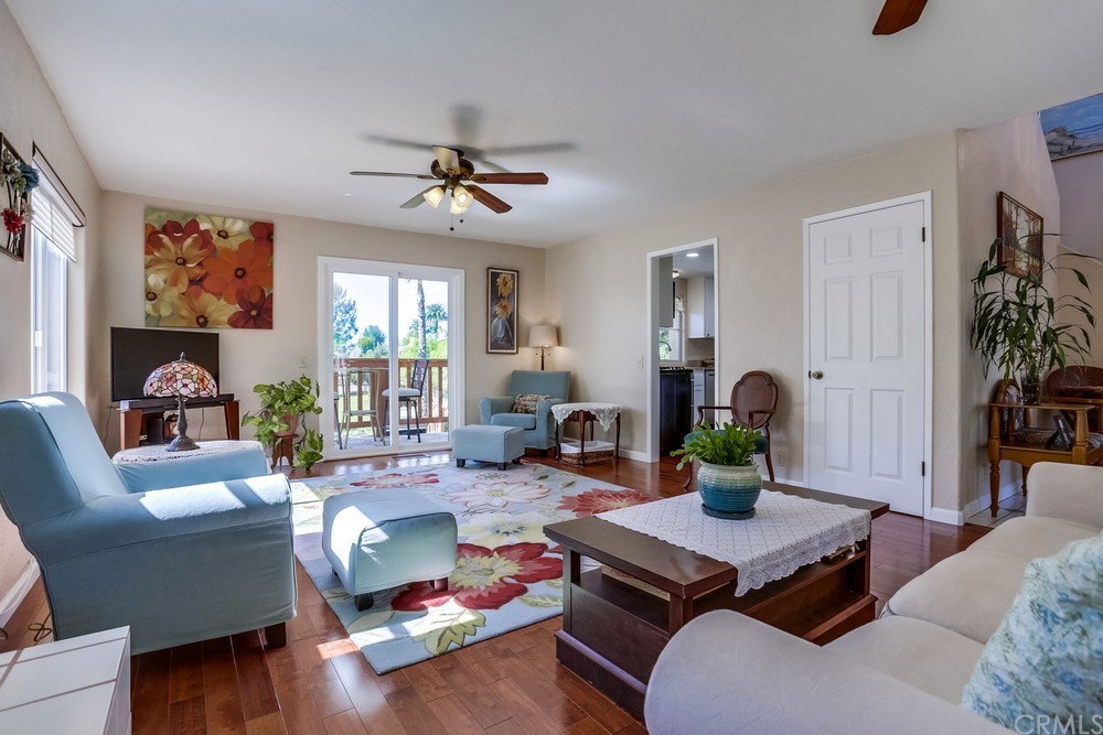 2725 Alta Vista Drive Fallbrook, CA 92028 - Photo 12 of 50 a living room with furniture a flat screen tv and a window