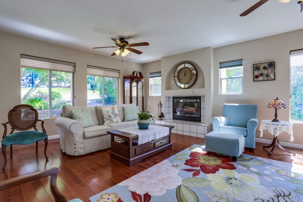 2725 Alta Vista Drive Fallbrook, CA 92028 - Photo 14 of 50 a living room with furniture a rug and a fireplace