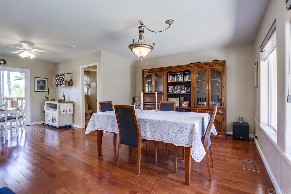 2725 Alta Vista Drive Fallbrook, CA 92028 - Photo 15 of 50 a view of a dining room with furniture and wooden floor