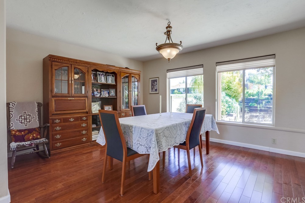 2725 Alta Vista Drive Fallbrook, CA 92028 - Photo 16 of 50 a view of a dining room with furniture window and wooden floor