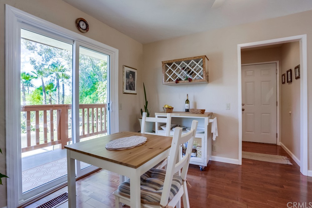 2725 Alta Vista Drive Fallbrook, CA 92028 - Photo 17 of 50 a view of a dining room with furniture window and wooden floor