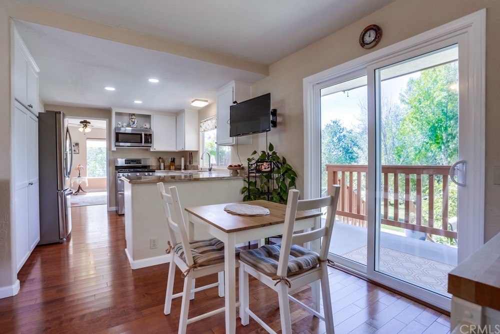2725 Alta Vista Drive Fallbrook, CA 92028 - Photo 18 of 50 a dining room with furniture and wooden floor