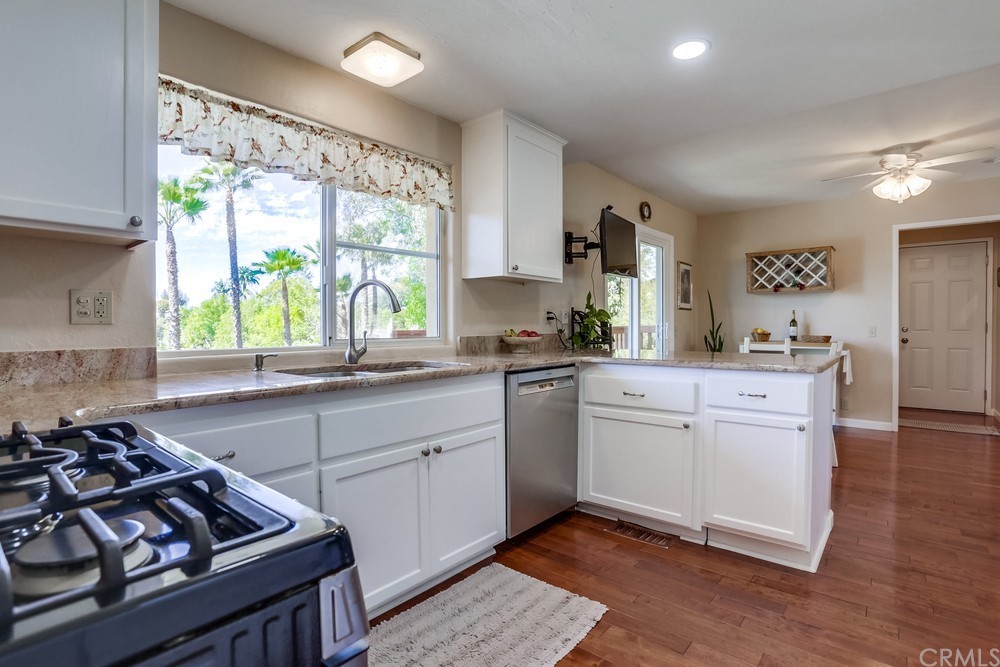 2725 Alta Vista Drive Fallbrook, CA 92028 - Photo 19 of 50 a kitchen with a sink stove and cabinets