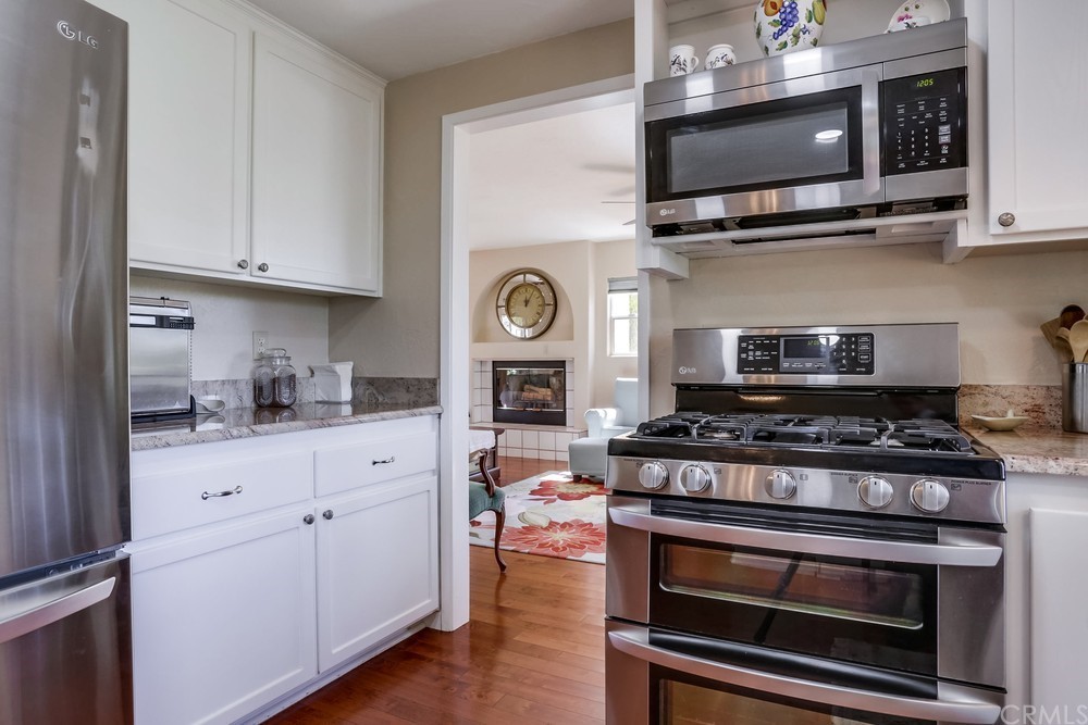 2725 Alta Vista Drive Fallbrook, CA 92028 - Photo 20 of 50 a kitchen with stainless steel appliances granite countertop a stove and a microwave