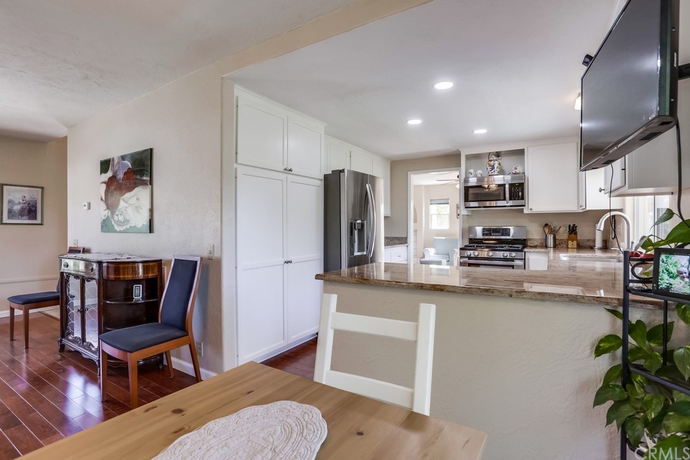 2725 Alta Vista Drive Fallbrook, CA 92028 - Photo 22 of 50 a kitchen with stainless steel appliances granite countertop sink stove and cabinets