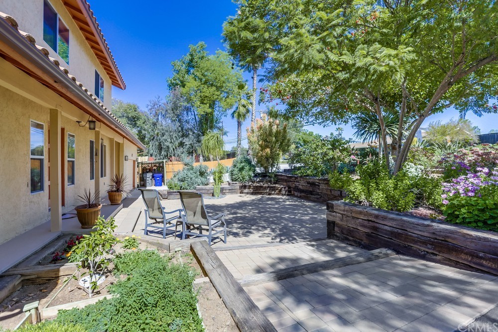 2725 Alta Vista Drive Fallbrook, CA 92028 - Photo 6 of 50 a view of a patio with table and chairs and potted plants