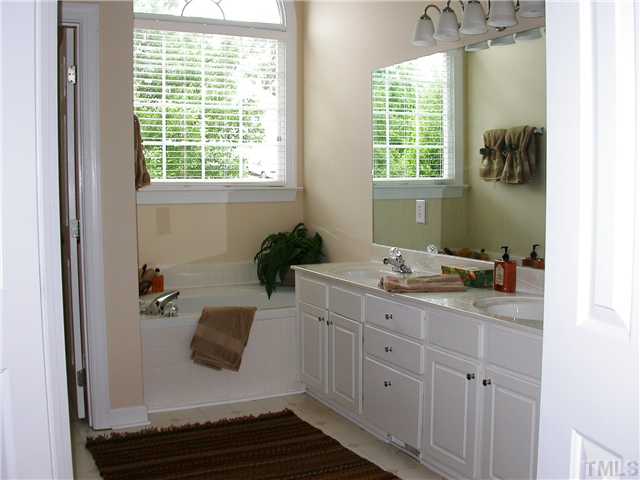 3524 La Costa Way Raleigh, NC 27610 - Photo 18 of 25 Luxurious Owner's Spa feaures soaking tub, separate shower, double vanity, and lots of natural lighting.
