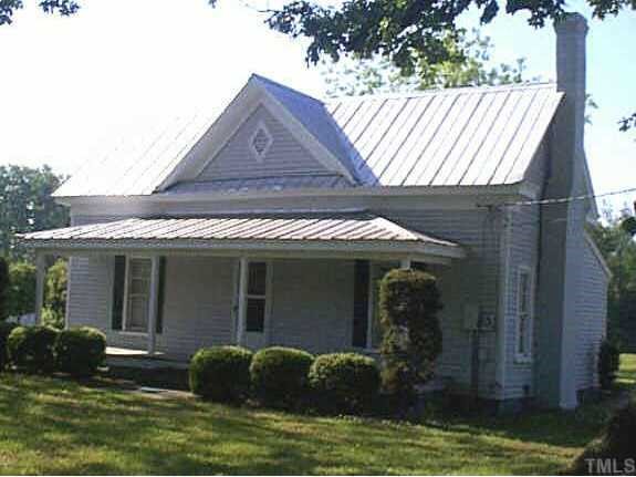 393 Lipscomb Road Angier, NC 27501 - Photo 1 of 1 a front view of a house with garden