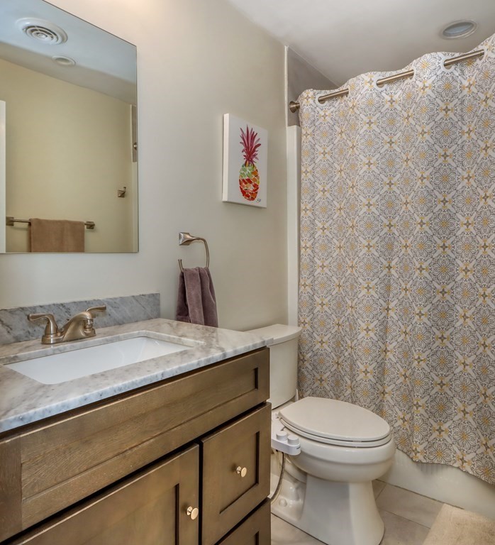 106 Shaw Farm Road, Unit 106 Canton, MA 02021 - Photo 14 of 27 a bathroom with a granite countertop sink mirror vanity and toilet
