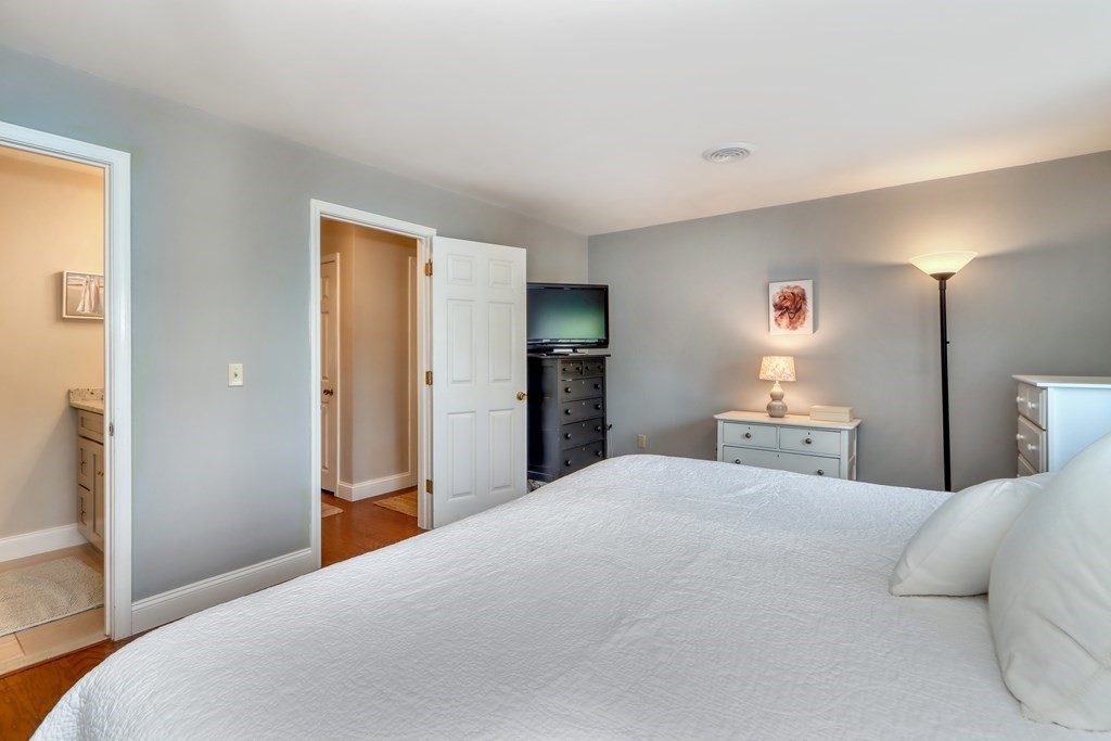 106 Shaw Farm Road, Unit 106 Canton, MA 02021 - Photo 15 of 27 a large bedroom with a bed and a bathroom