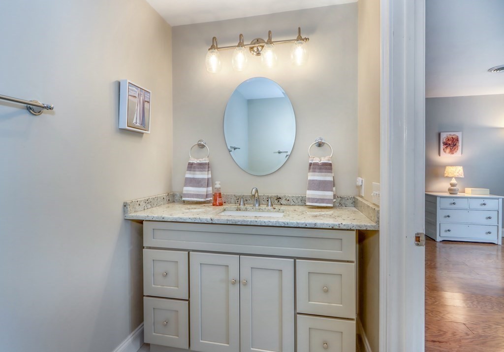 106 Shaw Farm Road, Unit 106 Canton, MA 02021 - Photo 17 of 27 a bathroom with a sink and a mirror