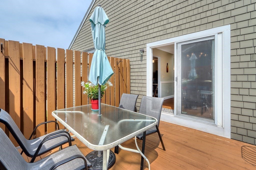 106 Shaw Farm Road, Unit 106 Canton, MA 02021 - Photo 22 of 27 a dining room with outdoor seating space