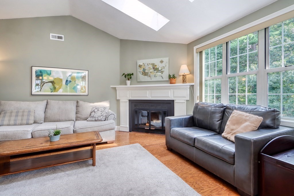 106 Shaw Farm Road, Unit 106 Canton, MA 02021 - Photo 6 of 27 a living room with furniture and a fireplace