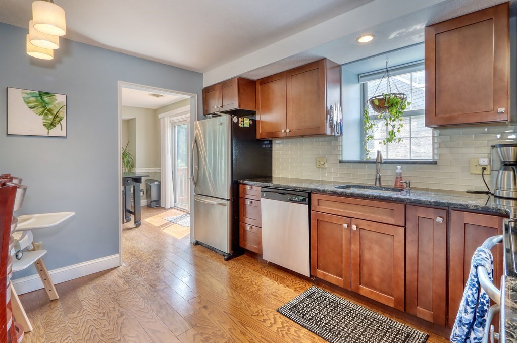106 Shaw Farm Road, Unit 106 Canton, MA 02021 - Photo 10 of 27 a kitchen with stainless steel appliances granite countertop a refrigerator sink and stove