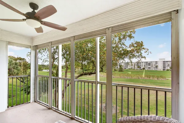 a view of a balcony with furniture