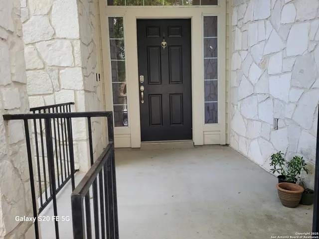 a view of a porch with wooden floor