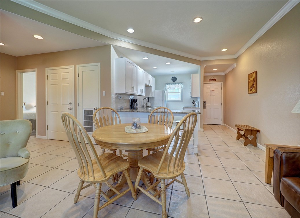 700 Island Retreat Road, Unit 37 Port Aransas, TX 78373 - Photo 11 of 34 a view of a dining room with furniture