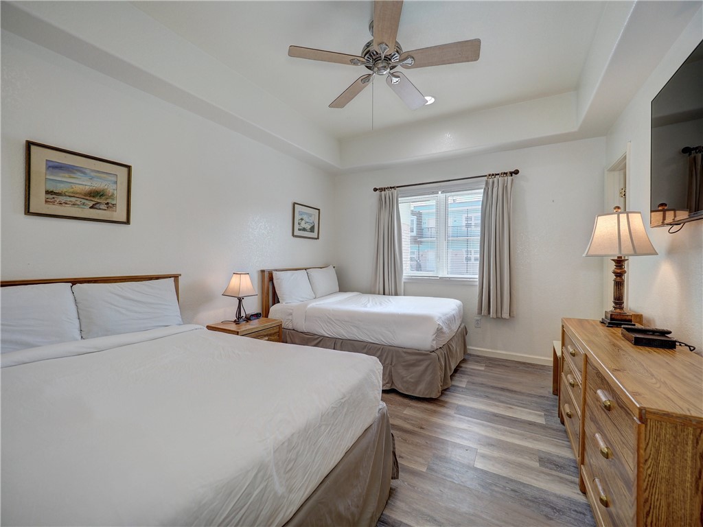 700 Island Retreat Road, Unit 37 Port Aransas, TX 78373 - Photo 15 of 34 a bedroom with bed and window