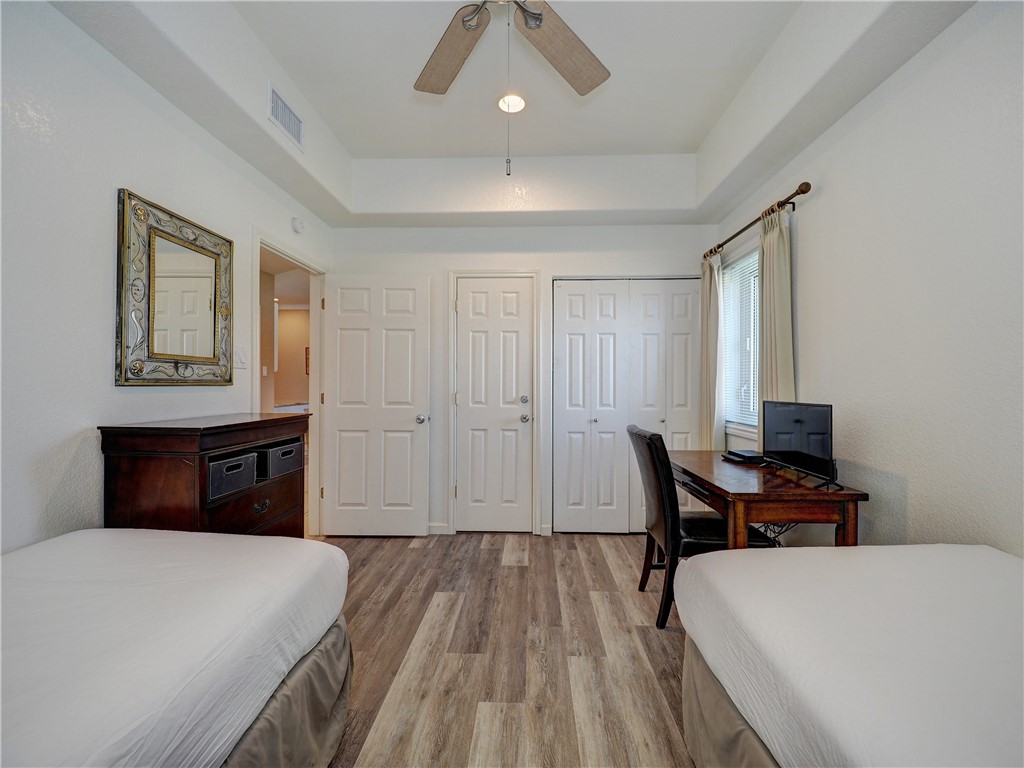 700 Island Retreat Road, Unit 37 Port Aransas, TX 78373 - Photo 18 of 34 a bedroom with a bed and a table