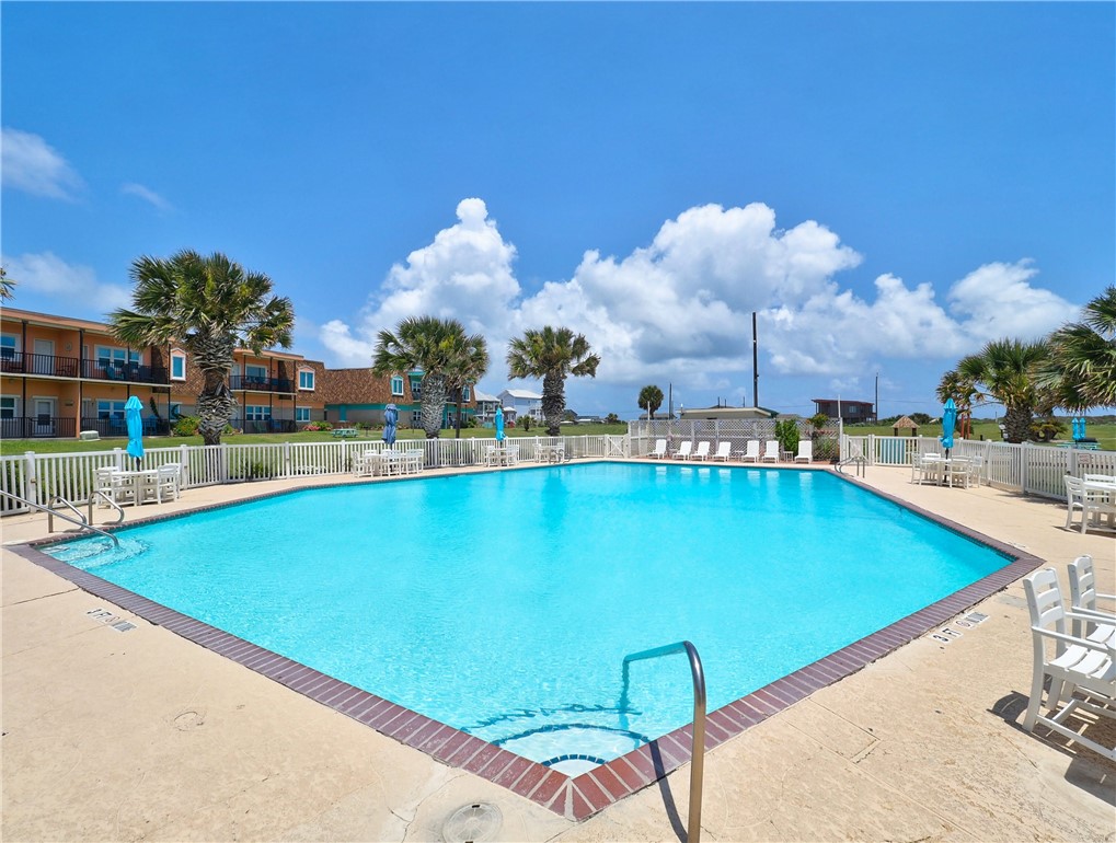 700 Island Retreat Road, Unit 37 Port Aransas, TX 78373 - Photo 24 of 34 a view of a swimming pool with outdoor seating