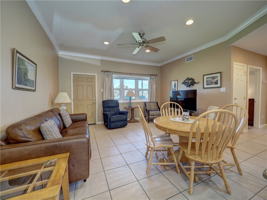 700 Island Retreat Road, Unit 37 Port Aransas, TX 78373 - Photo 3 of 34 a living room with furniture and a window
