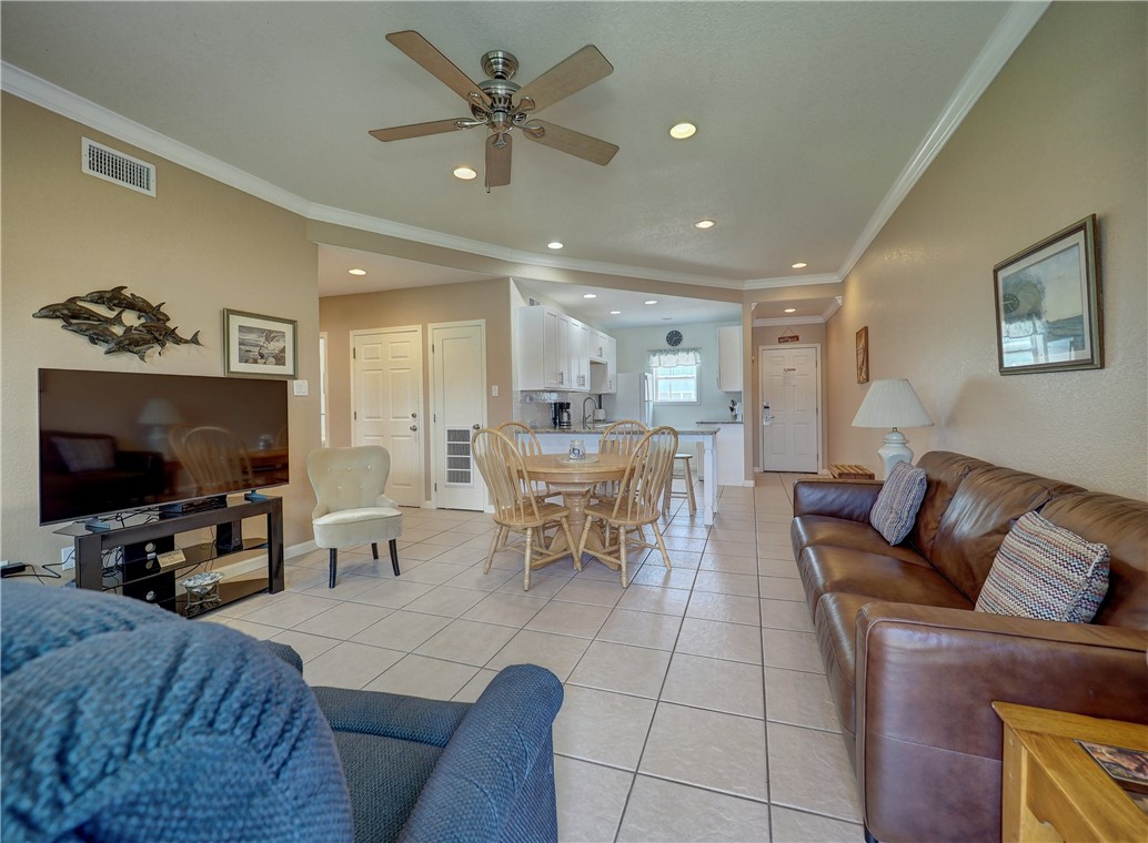 700 Island Retreat Road, Unit 37 Port Aransas, TX 78373 - Photo 4 of 34 a living room with furniture and a flat screen tv