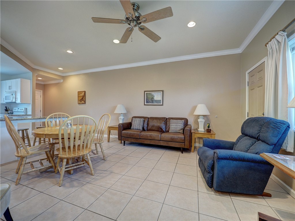 700 Island Retreat Road, Unit 37 Port Aransas, TX 78373 - Photo 6 of 34 a living room with furniture and a large window