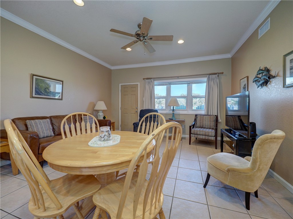 700 Island Retreat Road, Unit 37 Port Aransas, TX 78373 - Photo 10 of 34 a view of a dining room with furniture