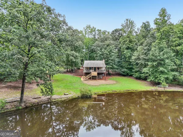 a view of a backyard with sitting area