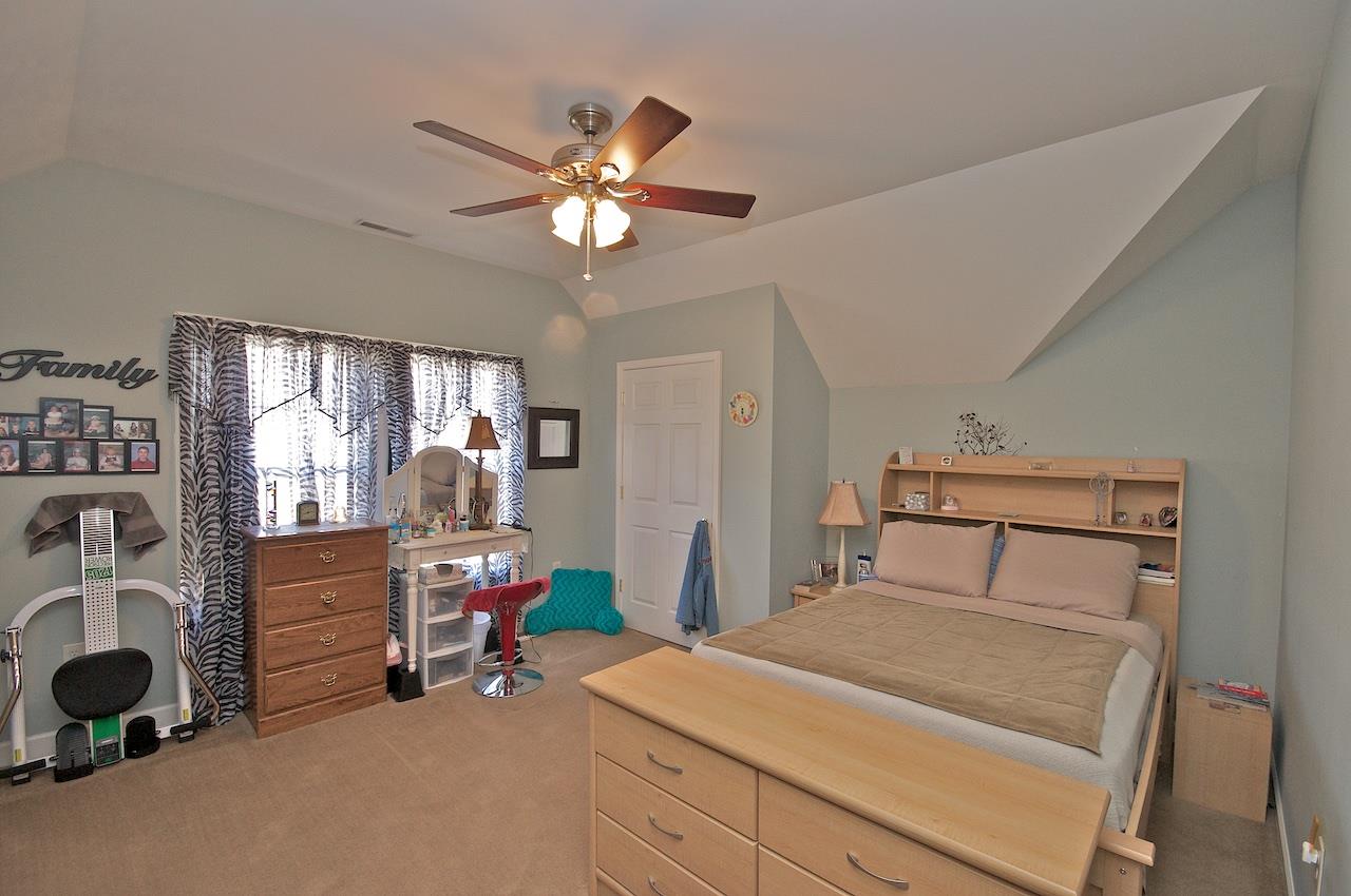 54 Jonestown Road Fairfield, VA 24435 - Photo 16 of 29 a bedroom with bed and a chandelier