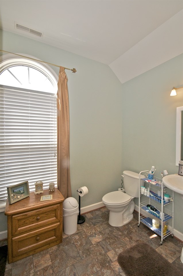 54 Jonestown Road Fairfield, VA 24435 - Photo 17 of 29 a bathroom with a toilet a sink and a window