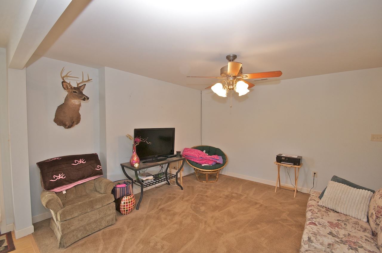 54 Jonestown Road Fairfield, VA 24435 - Photo 20 of 29 a bedroom with a bed and a chandelier