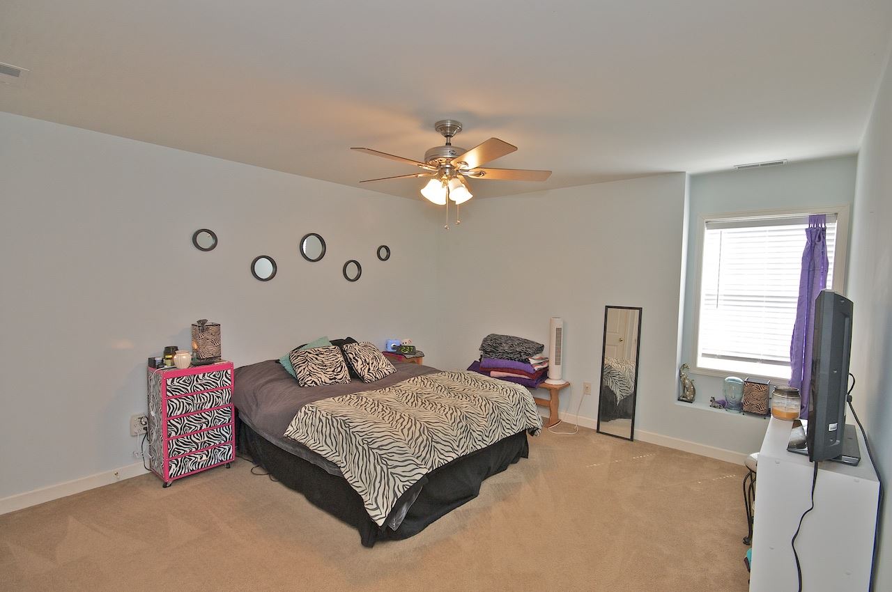 54 Jonestown Road Fairfield, VA 24435 - Photo 23 of 29 a bedroom with a bed and a chandelier