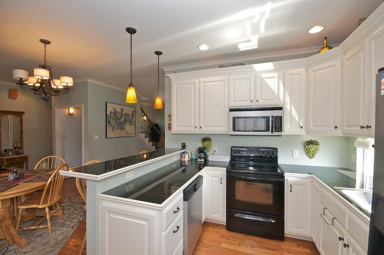 54 Jonestown Road Fairfield, VA 24435 - Photo 6 of 29 a kitchen with stainless steel appliances granite countertop a stove a sink and a microwave