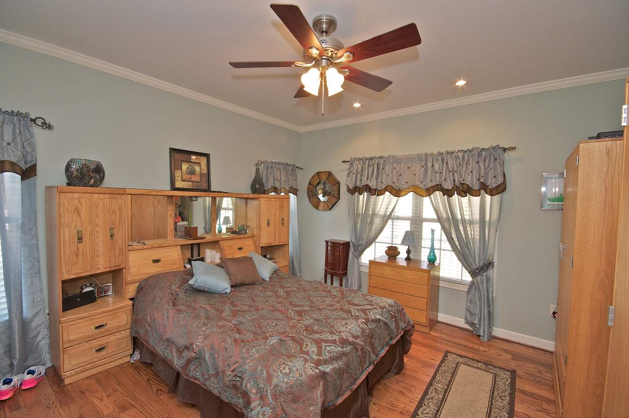 54 Jonestown Road Fairfield, VA 24435 - Photo 10 of 29 a bedroom with a bed and wooden floor