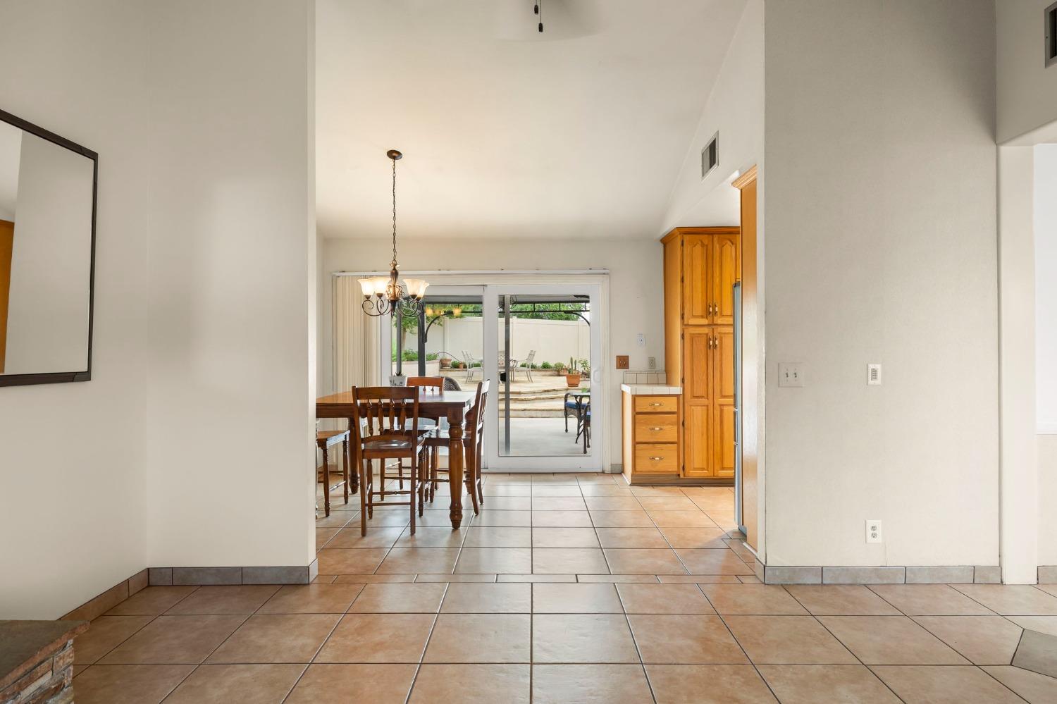 150 North Donna Street Oak View, CA 93022 - Photo 13 of 47 a dining room with furniture and a kitchen view