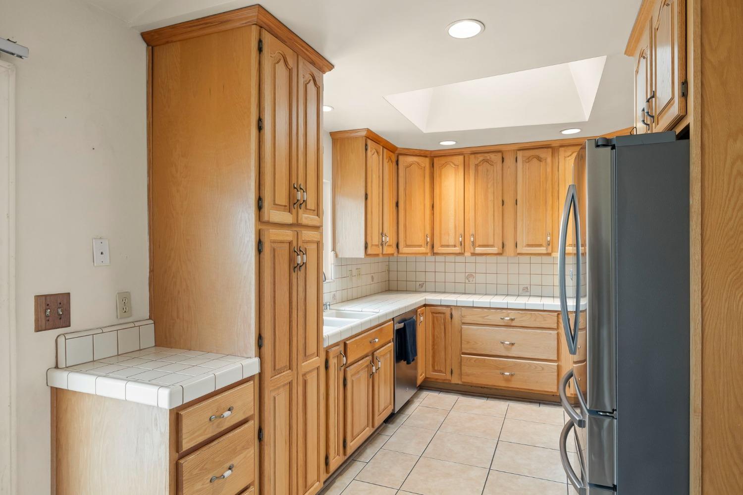 150 North Donna Street Oak View, CA 93022 - Photo 16 of 47 a bathroom with a granite countertop sink a mirror and a bathtub