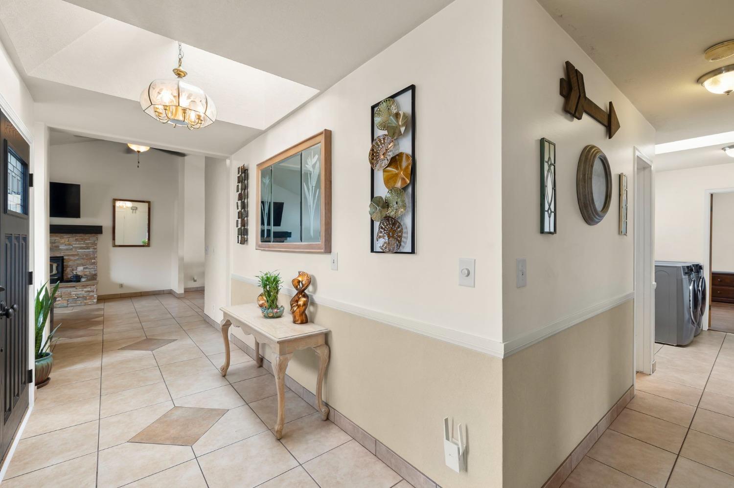150 North Donna Street Oak View, CA 93022 - Photo 20 of 47 a living room with furniture and a chandelier