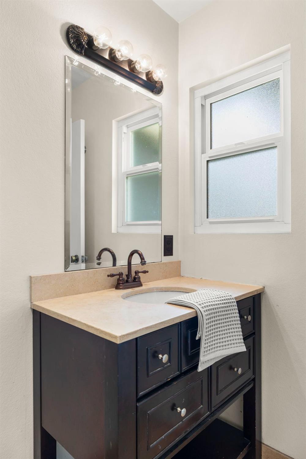 150 North Donna Street Oak View, CA 93022 - Photo 30 of 47 a bathroom with a sink vanity and a mirror