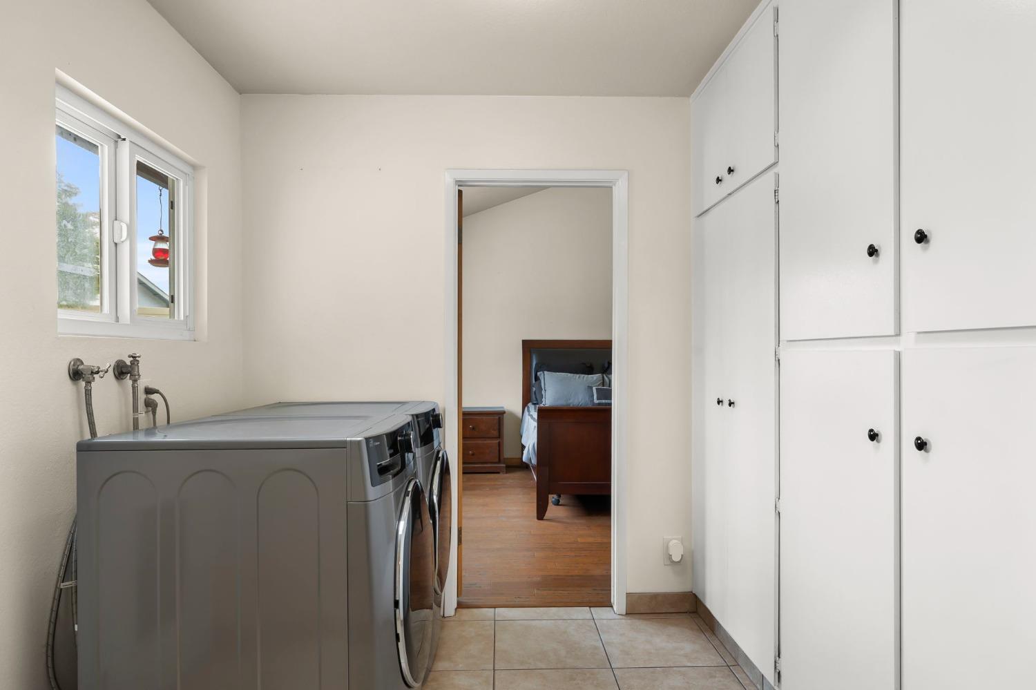 150 North Donna Street Oak View, CA 93022 - Photo 31 of 47 a utility room with cabinets washer and dryer