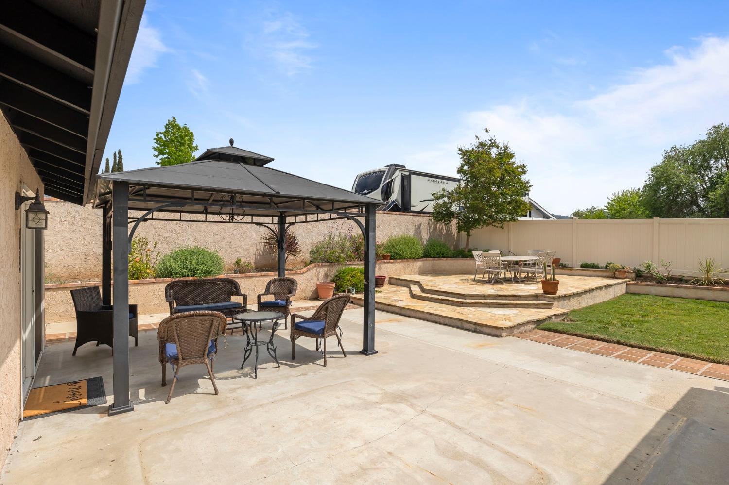 150 North Donna Street Oak View, CA 93022 - Photo 33 of 47 a view of a patio with a table chairs and a fire pit