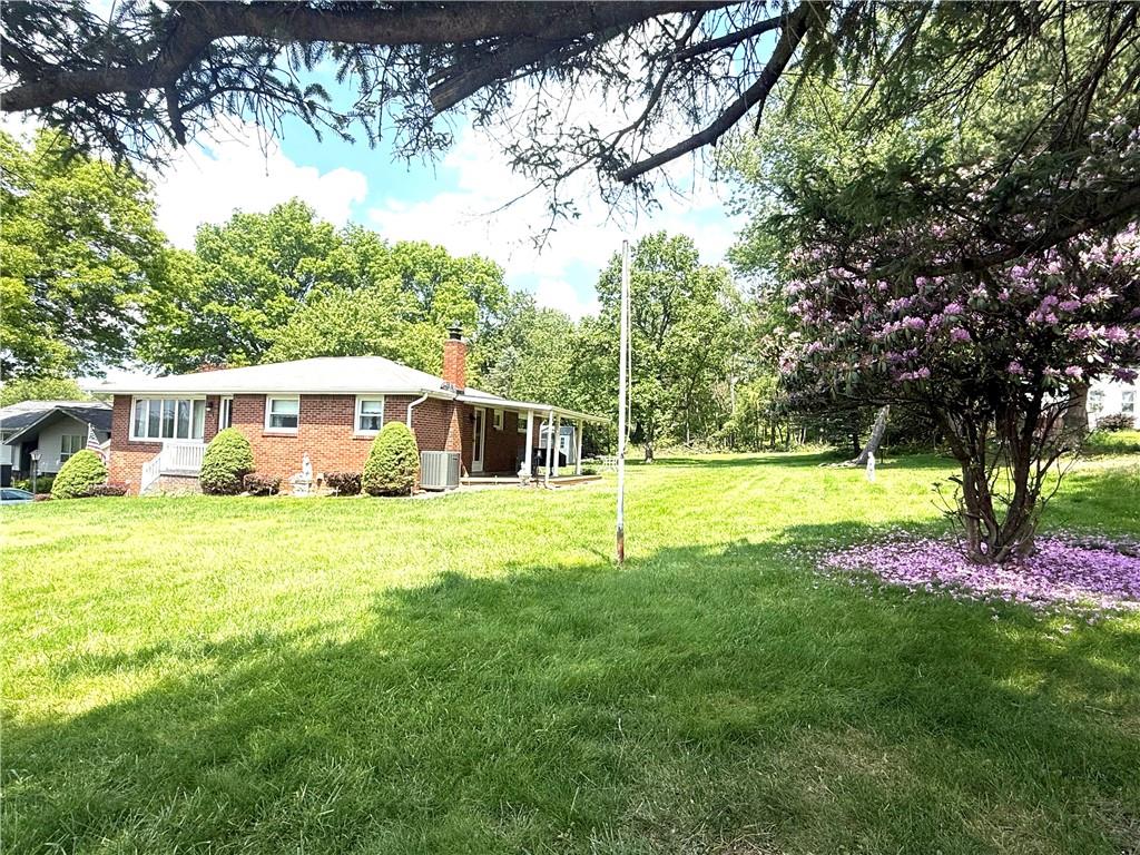 151 Huntingdon Road Wyano, PA 15695 - Photo 14 of 36 a view of a house with a big yard